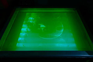 silkscreen frame with dreadzones dreadtimes album cover art being exposed on the lightbox